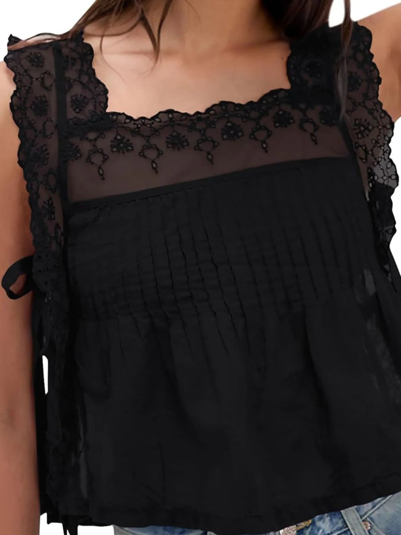 Lace-trimmed eyelet square neck top with tie detail.