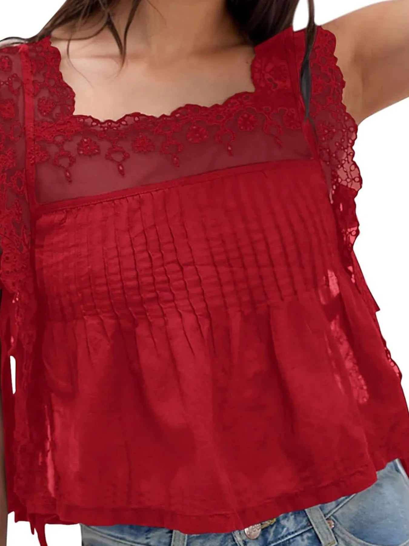 Lace-trimmed eyelet square neck top with tie detail.