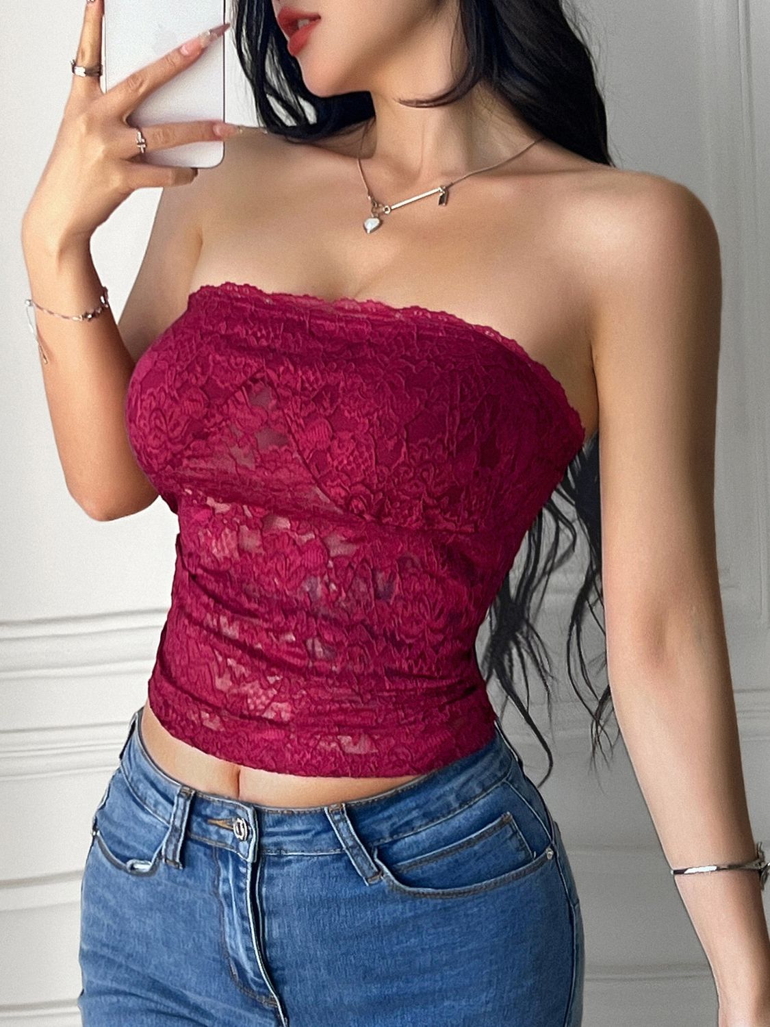 Lace tube top with semi-sheer design and high stretch.