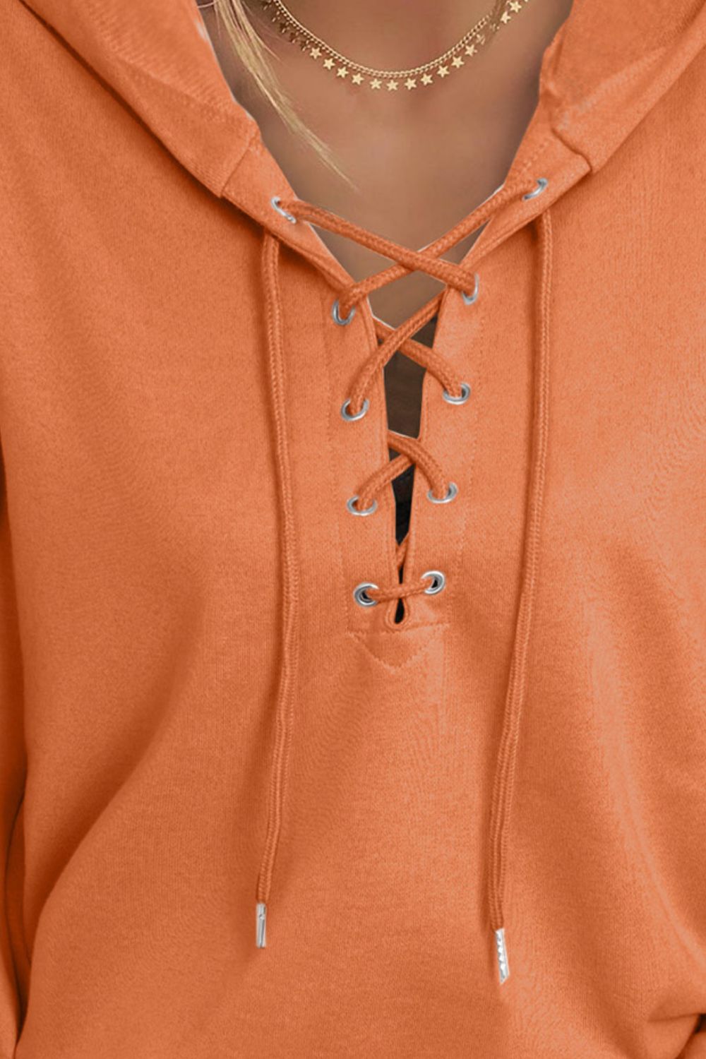 Lace up long sleeve hoodie.