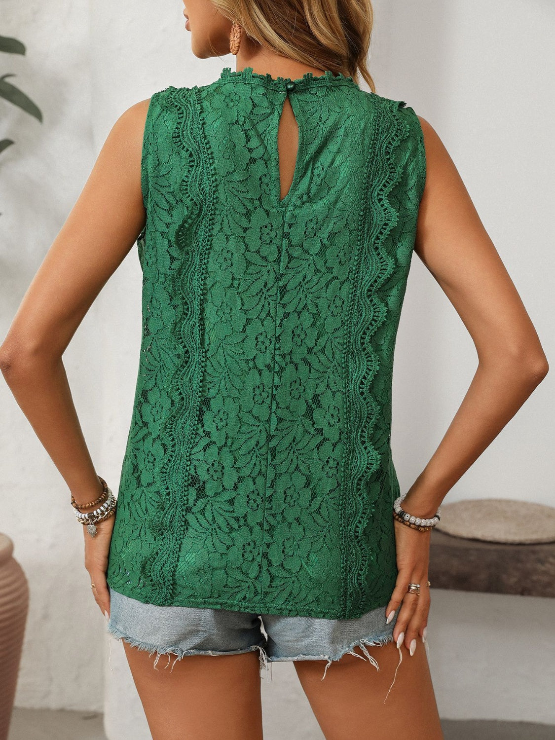 Lace V-neck tank top with buttons.
