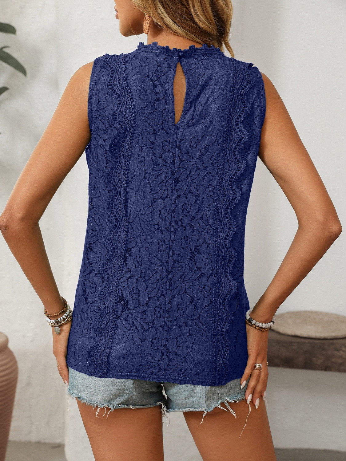 Lace V-neck tank top with buttons.