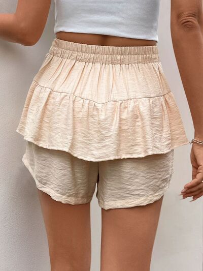 Layered printed elastic waist shorts.