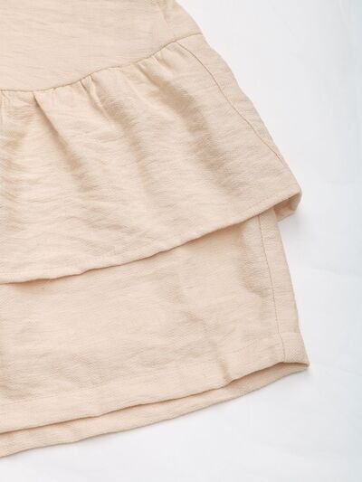 Layered printed elastic waist shorts.