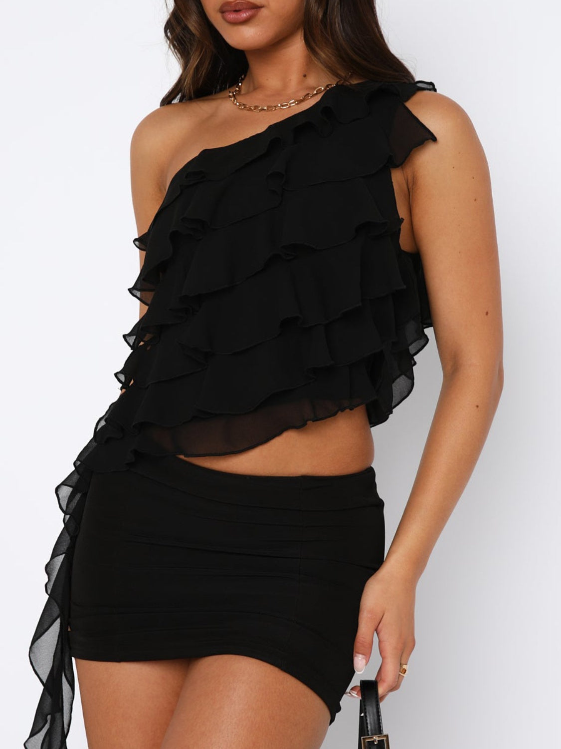 Layered ruffled one-shoulder tank top.