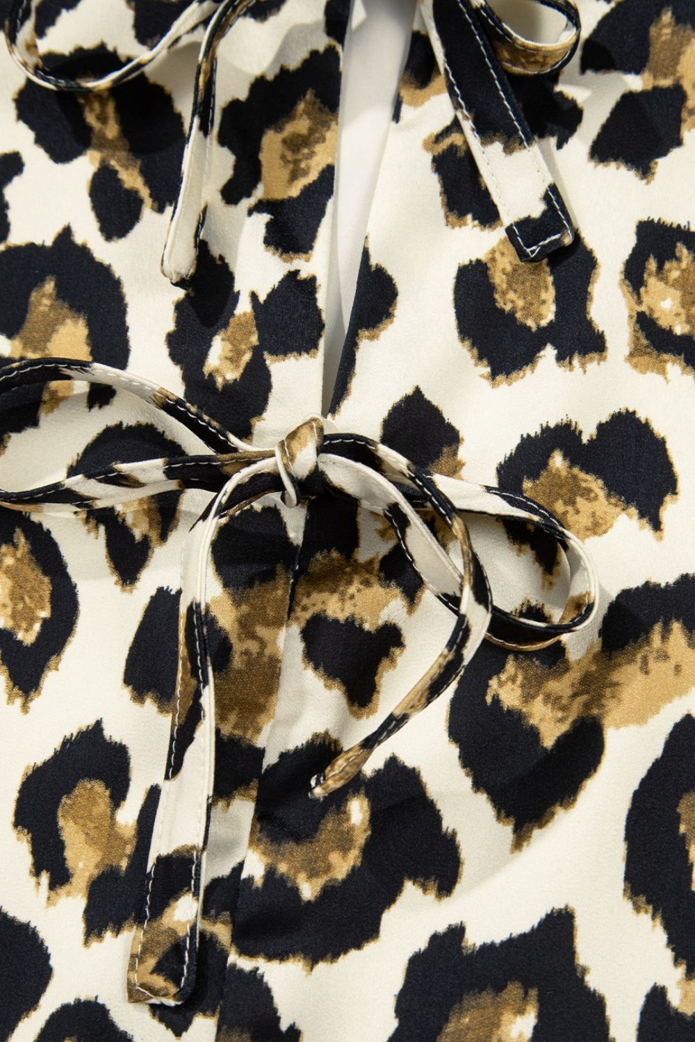 Leopard Bow Tie Front Puff Sleeve Peplum Blouse.