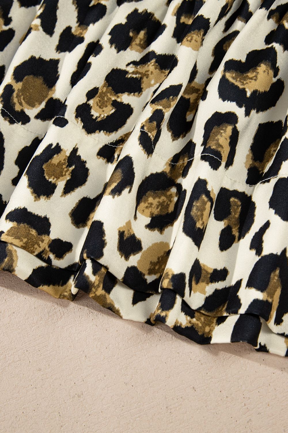 Leopard Bow Tie Front Puff Sleeve Peplum Blouse.