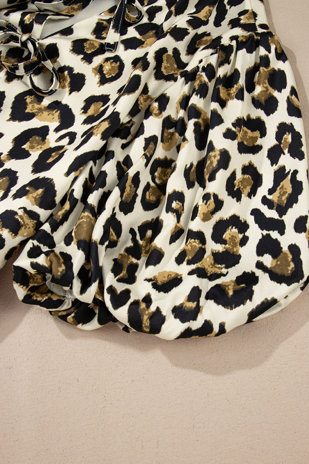 Leopard Bow Tie Front Puff Sleeve Peplum Blouse.