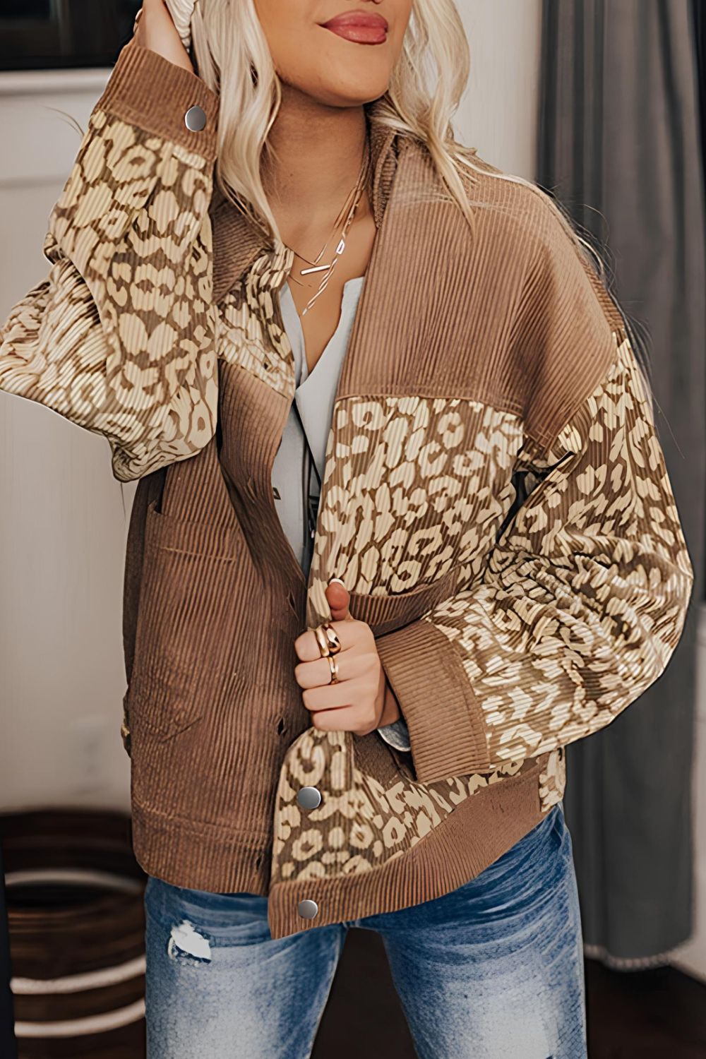 Leopard print button-up drop shoulder jacket with pockets.