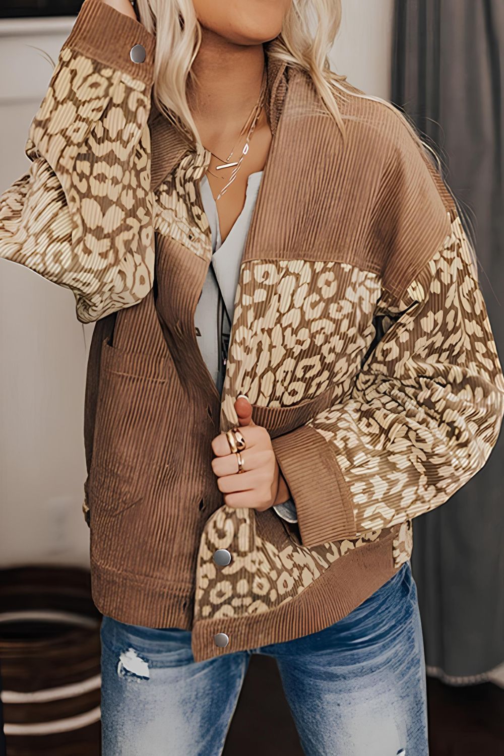 Leopard print button-up drop shoulder jacket with pockets.