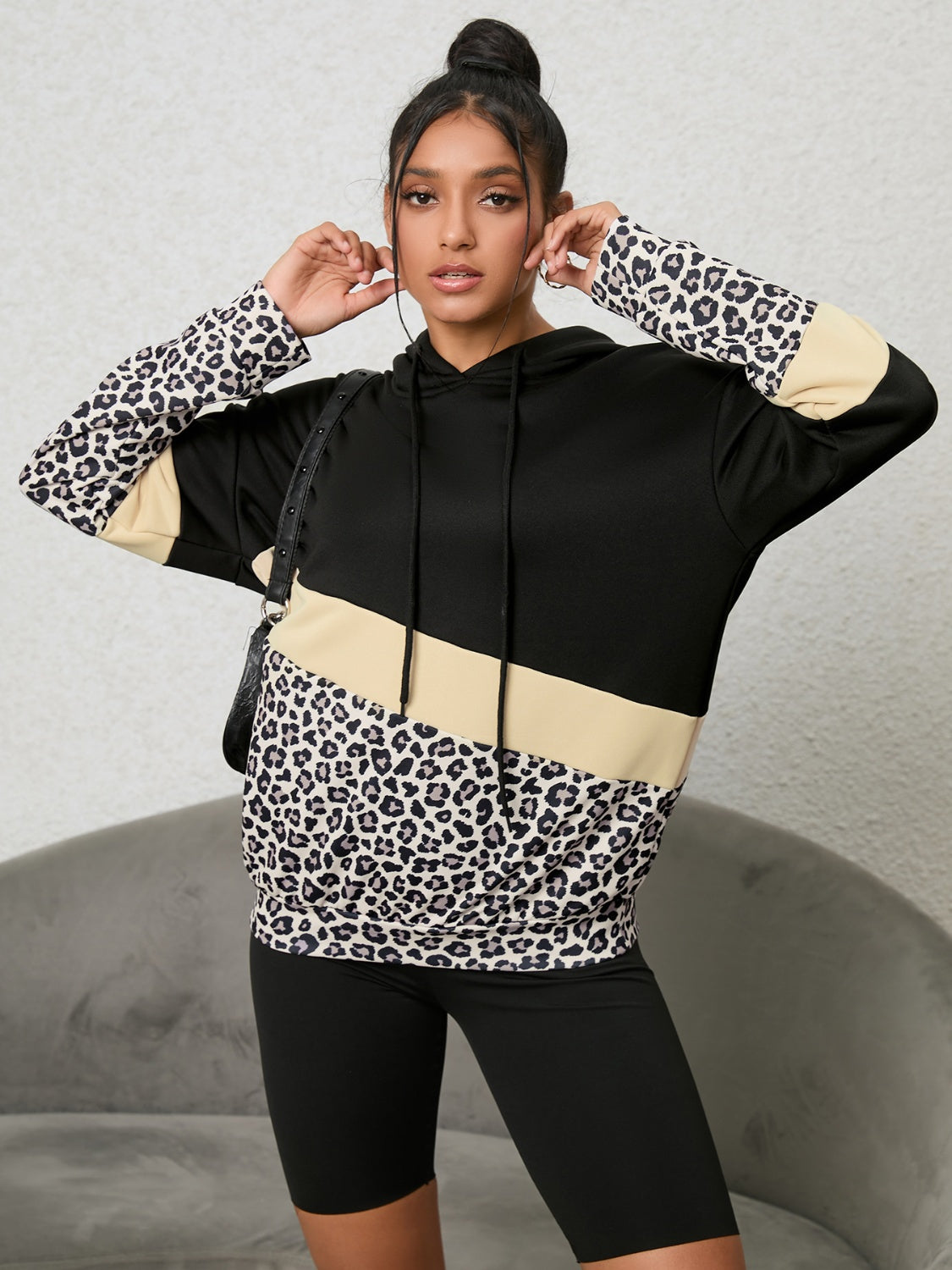 Leopard print and color block drawstring hoodie.
