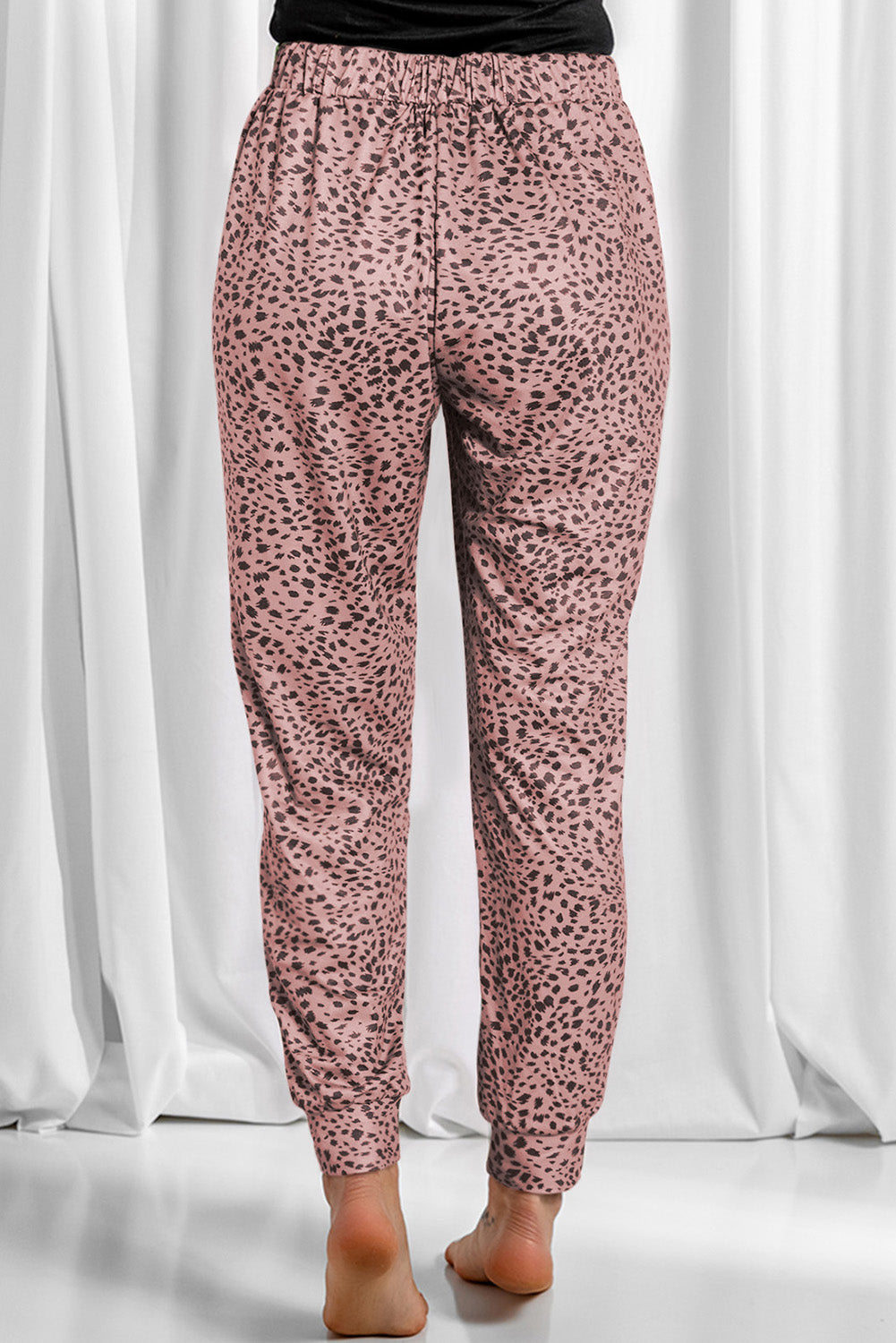Leopard drawstring pocketed pants, opaque.
