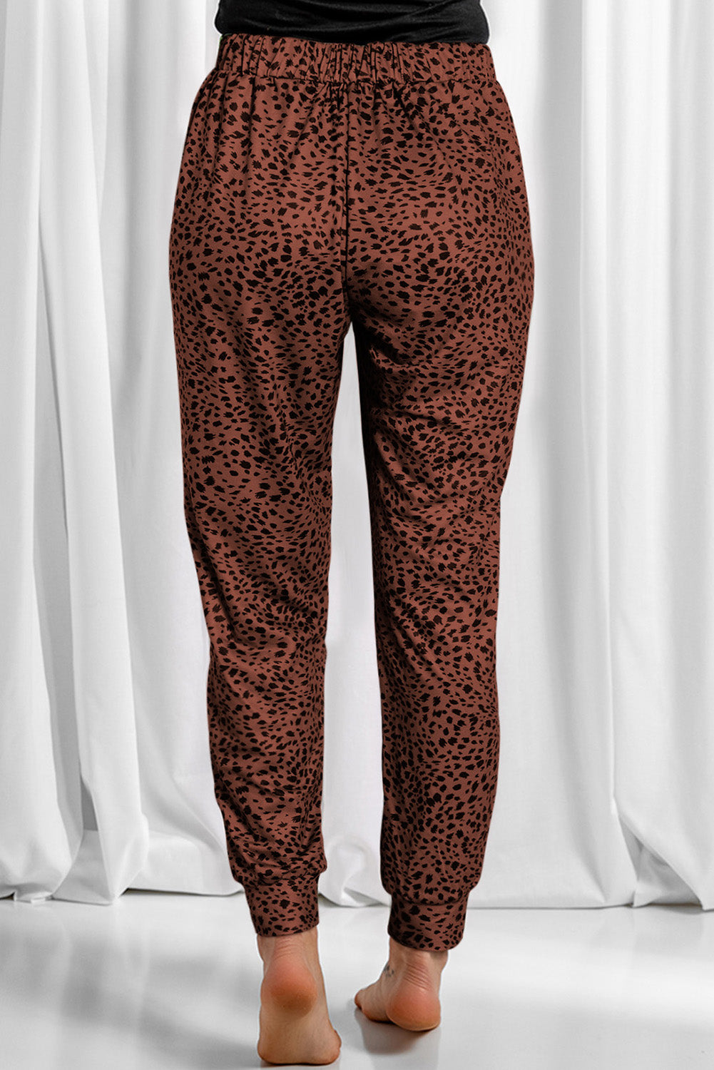 Leopard drawstring pocketed pants, opaque.