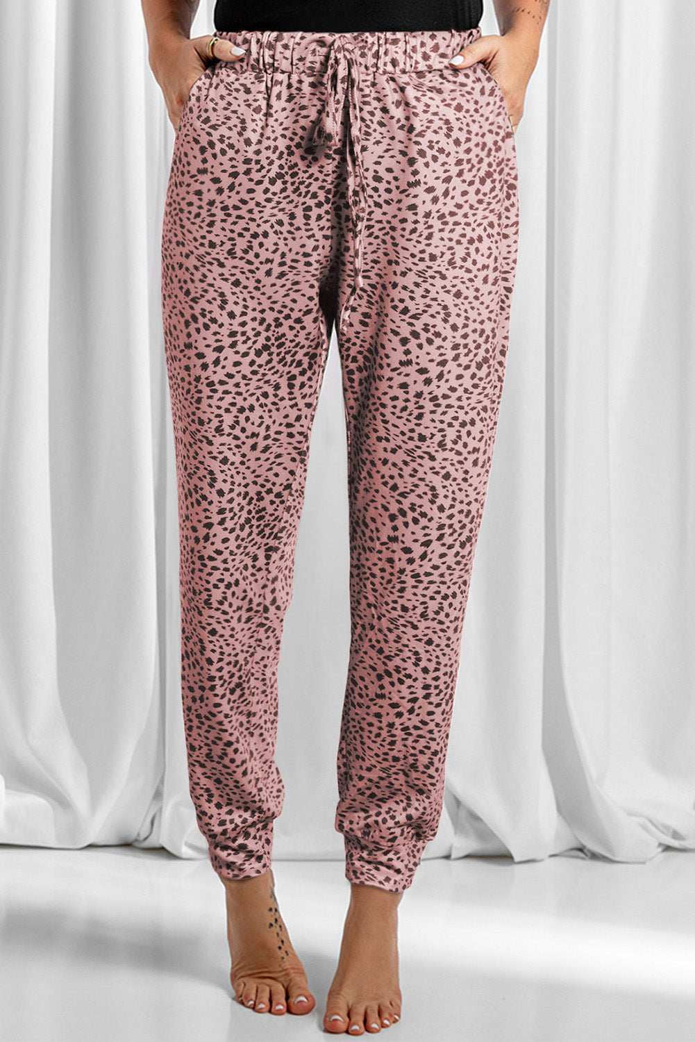 Leopard drawstring pocketed pants, opaque.