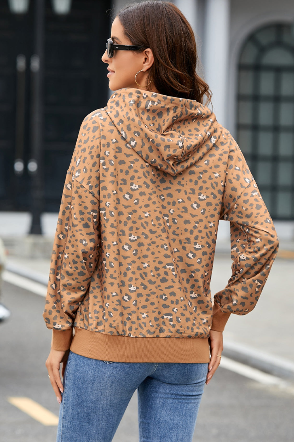 Leopard print long sleeve hooded regular length hoodie with drawstring.