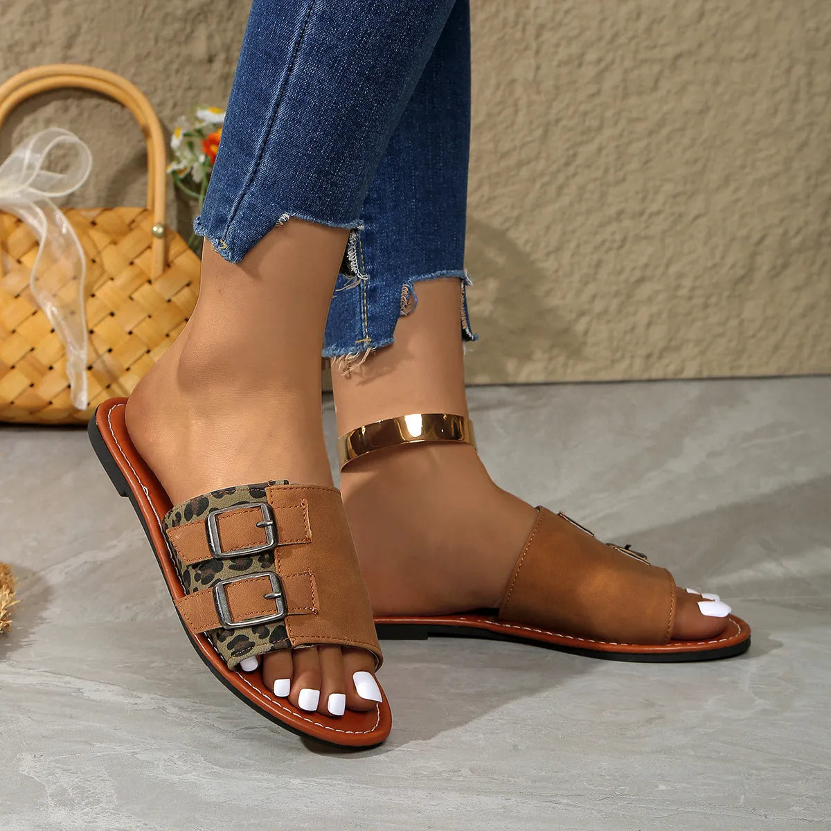 Leopard print open toe flat sandals.