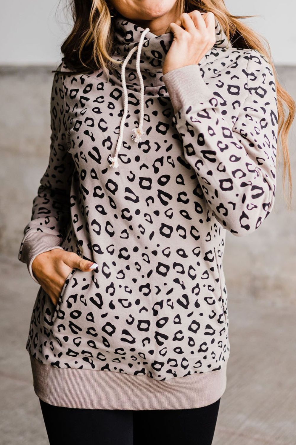 Leopard print long sleeve hooded long length hoodie with drawstring.
