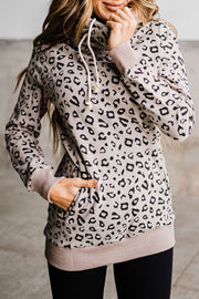Leopard print long sleeve hooded long length hoodie with drawstring.