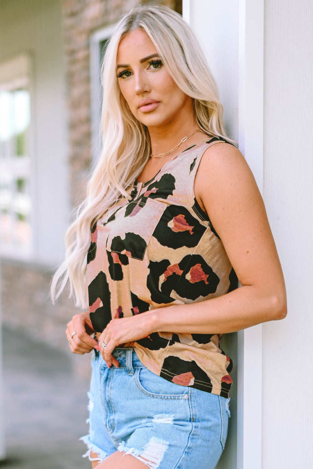 Leopard print round neck tank top with pockets.