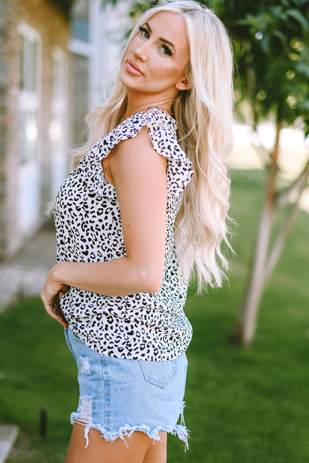 Leopard print ruffled notched tank top.