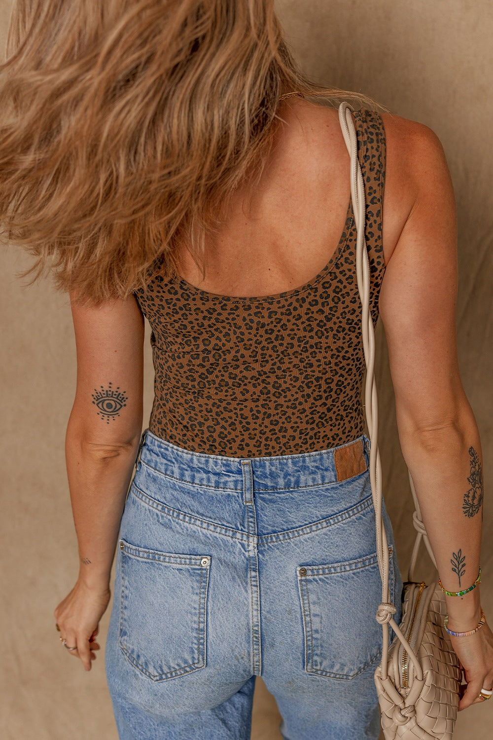 Leopard scoop neck wide strap bodysuit, opaque and slightly stretchy.