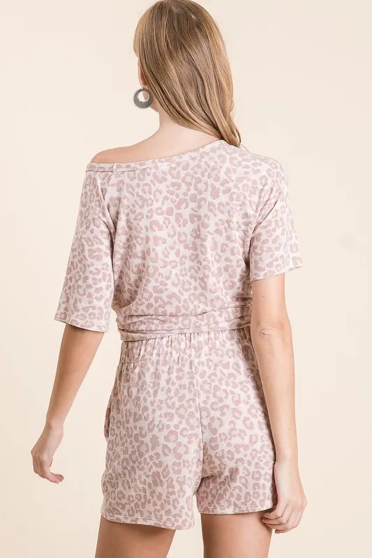 Plus size linen blend shorts with floral embroidered details and pockets.
