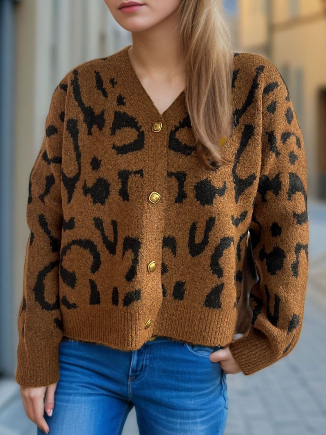 Leopard print V-neck button up cardigan.