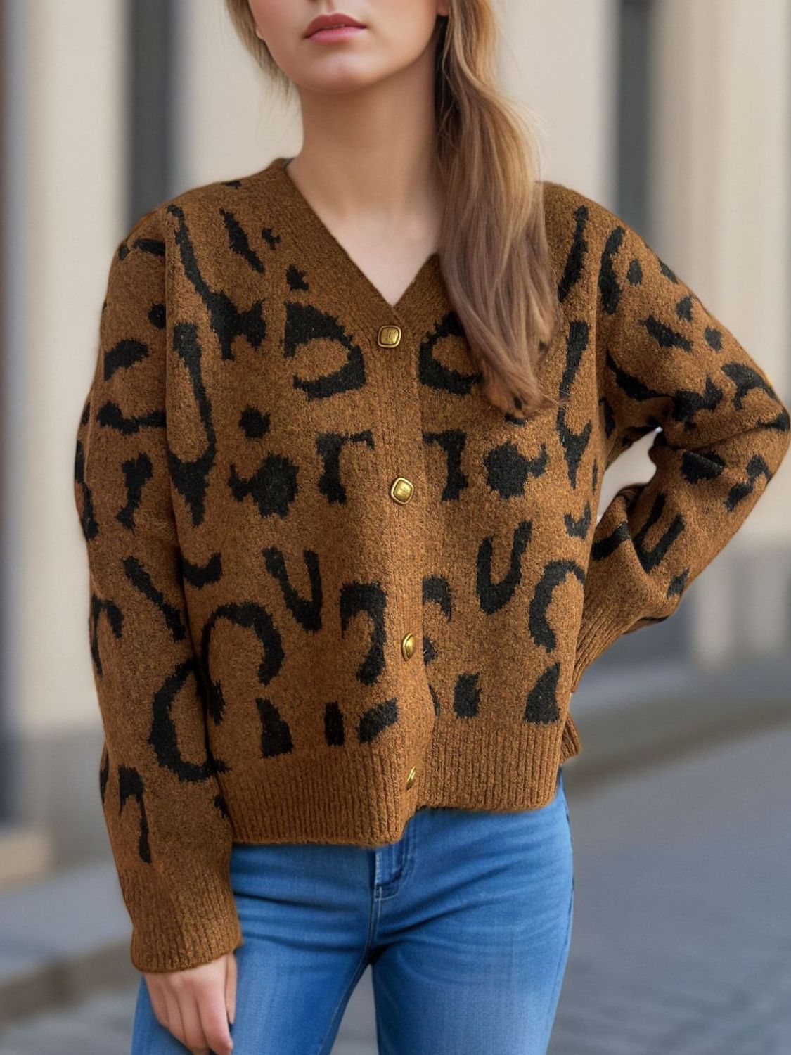 Leopard print V-neck button up cardigan.