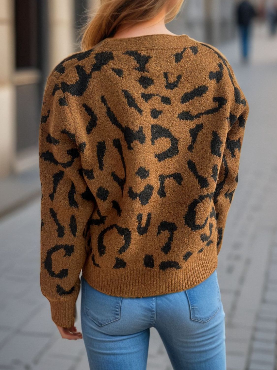 Leopard print V-neck button up cardigan.