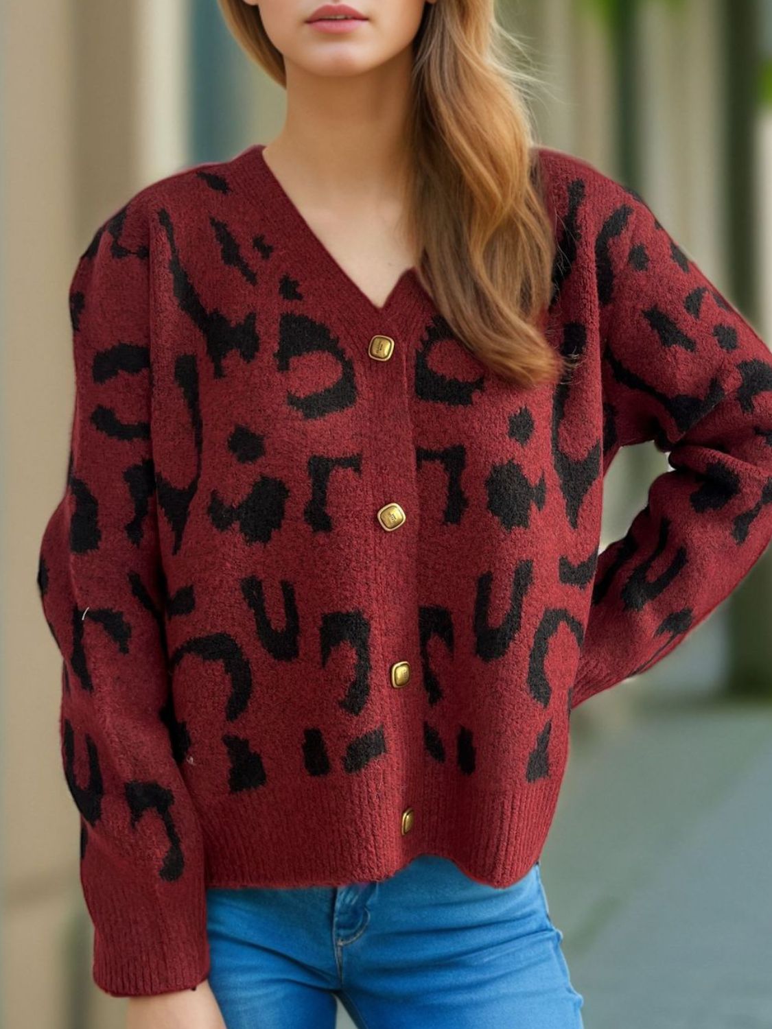 Leopard print V-neck button up cardigan.