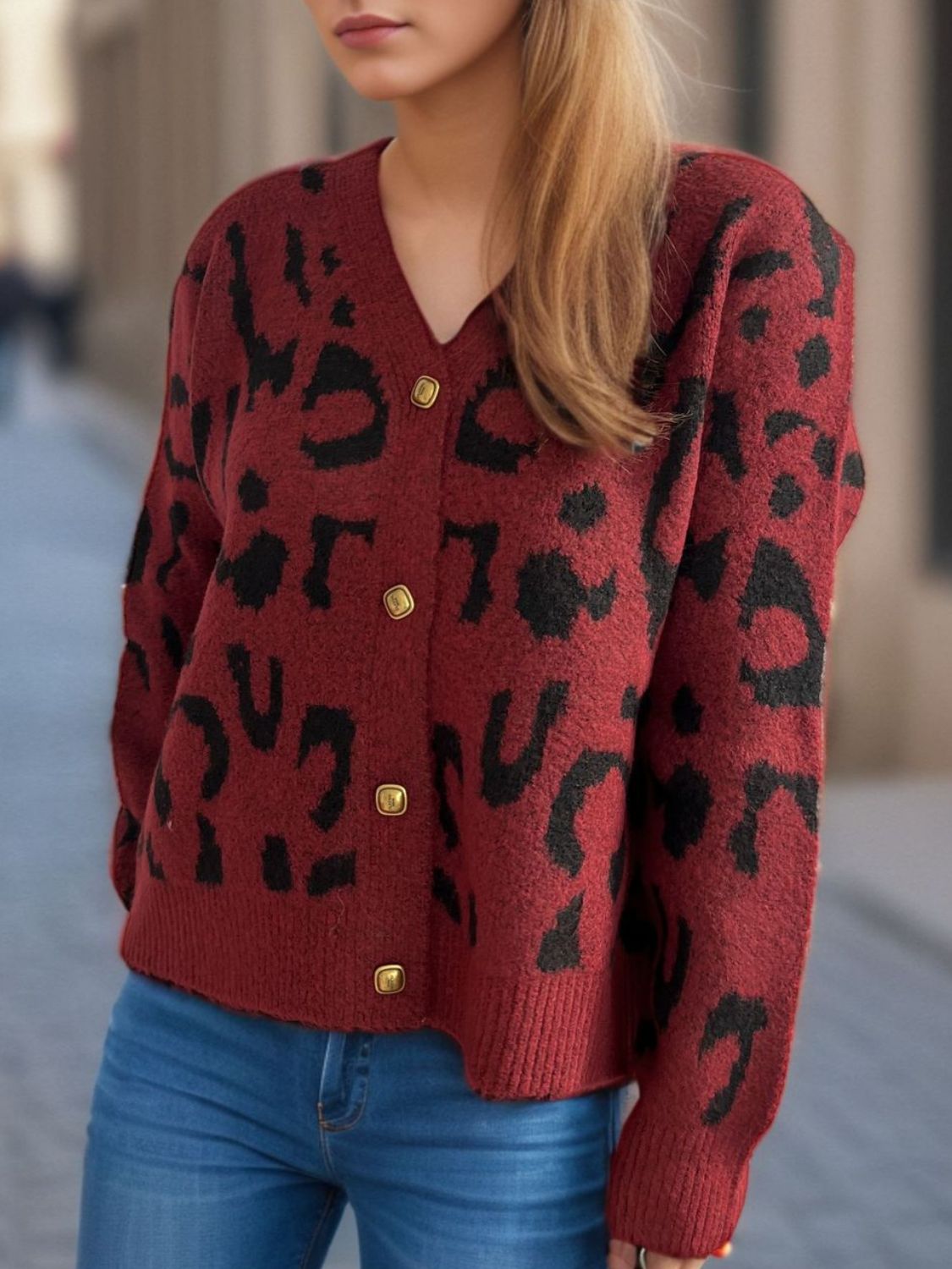 Leopard print V-neck button up cardigan.