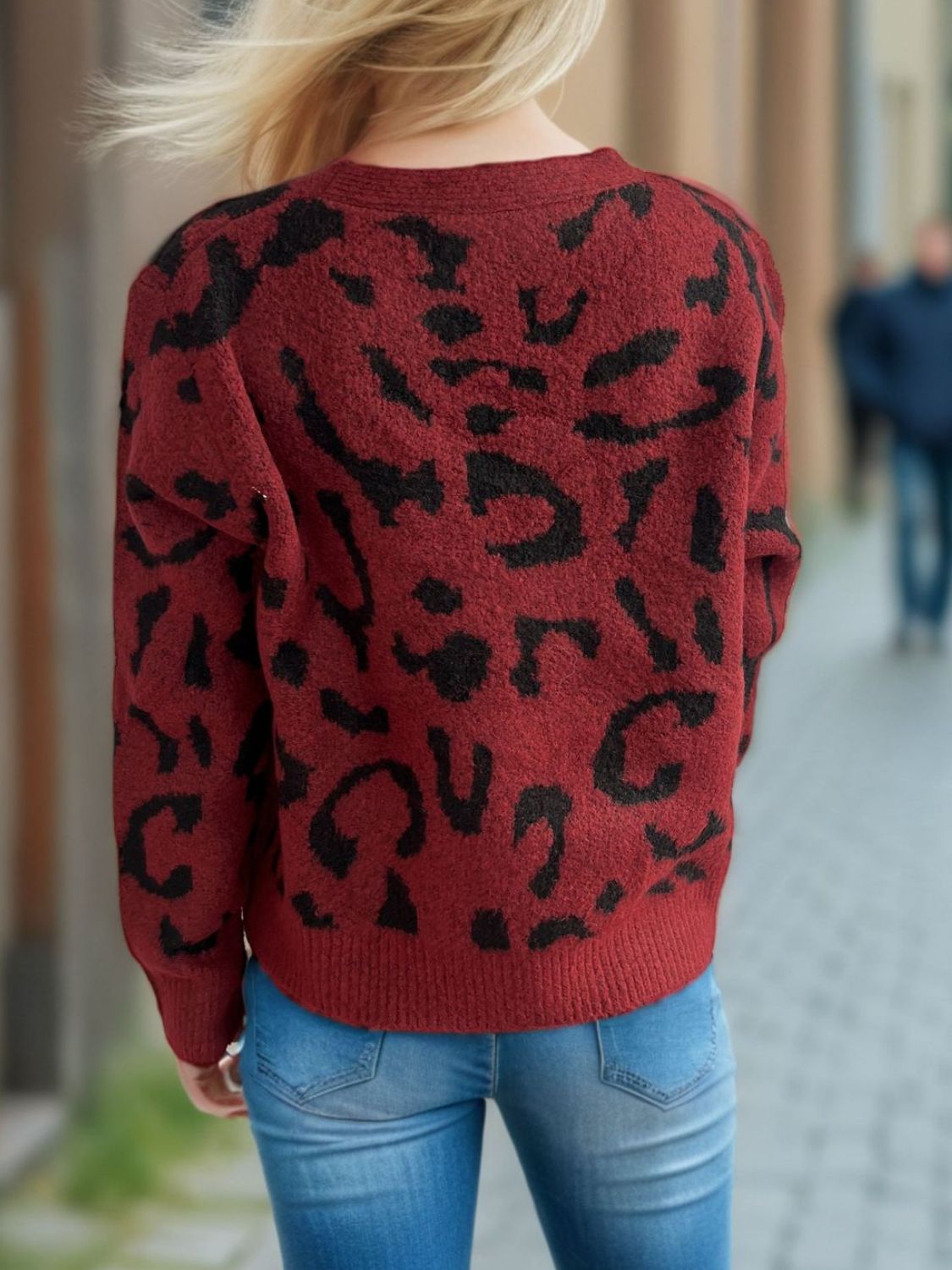 Leopard print V-neck button up cardigan.