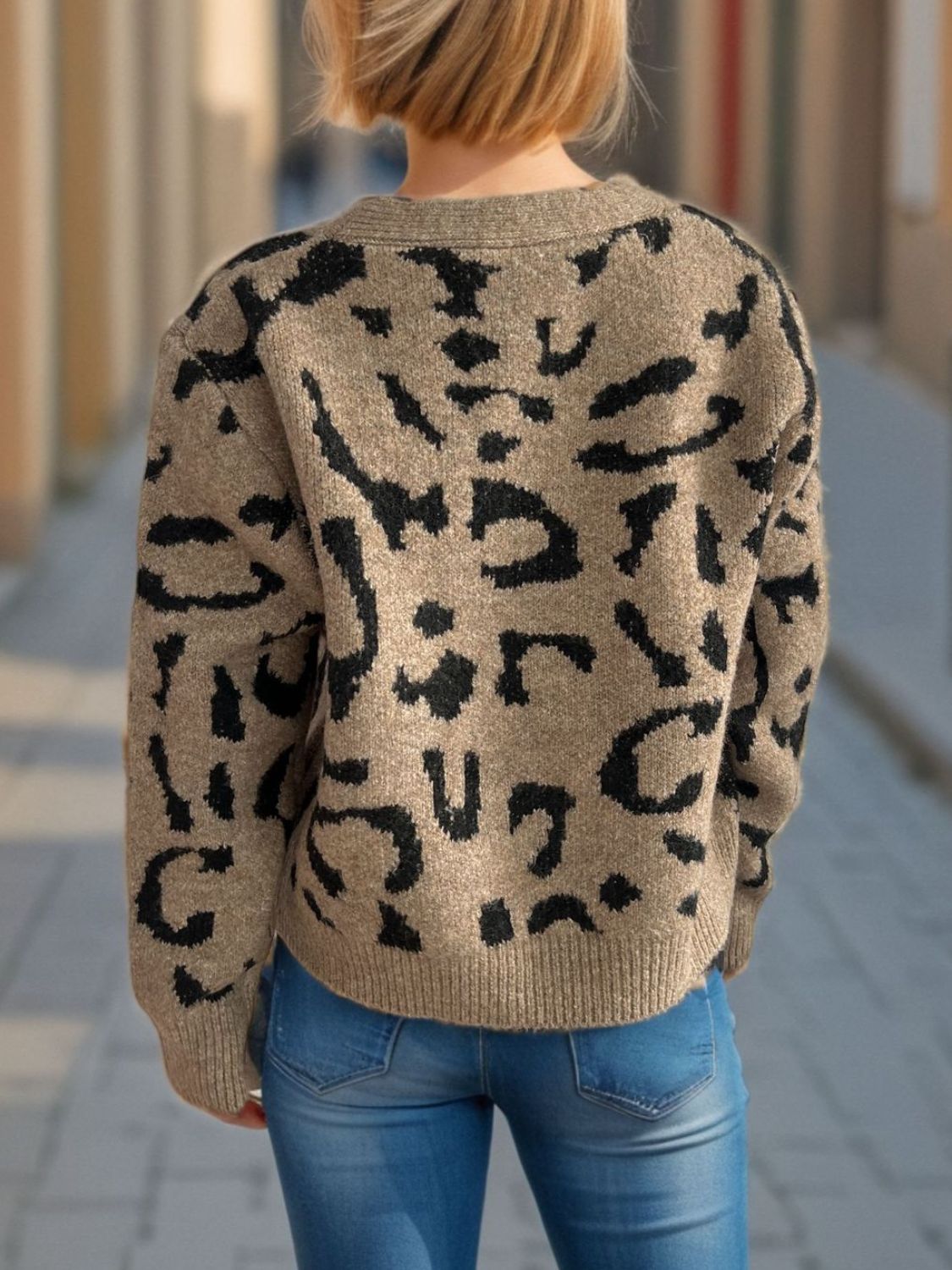 Leopard print V-neck button up cardigan.