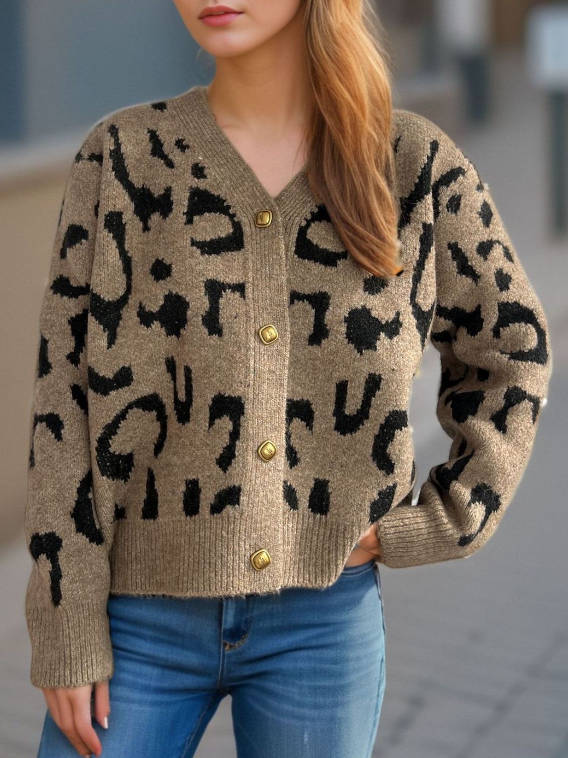 Leopard print V-neck button up cardigan.