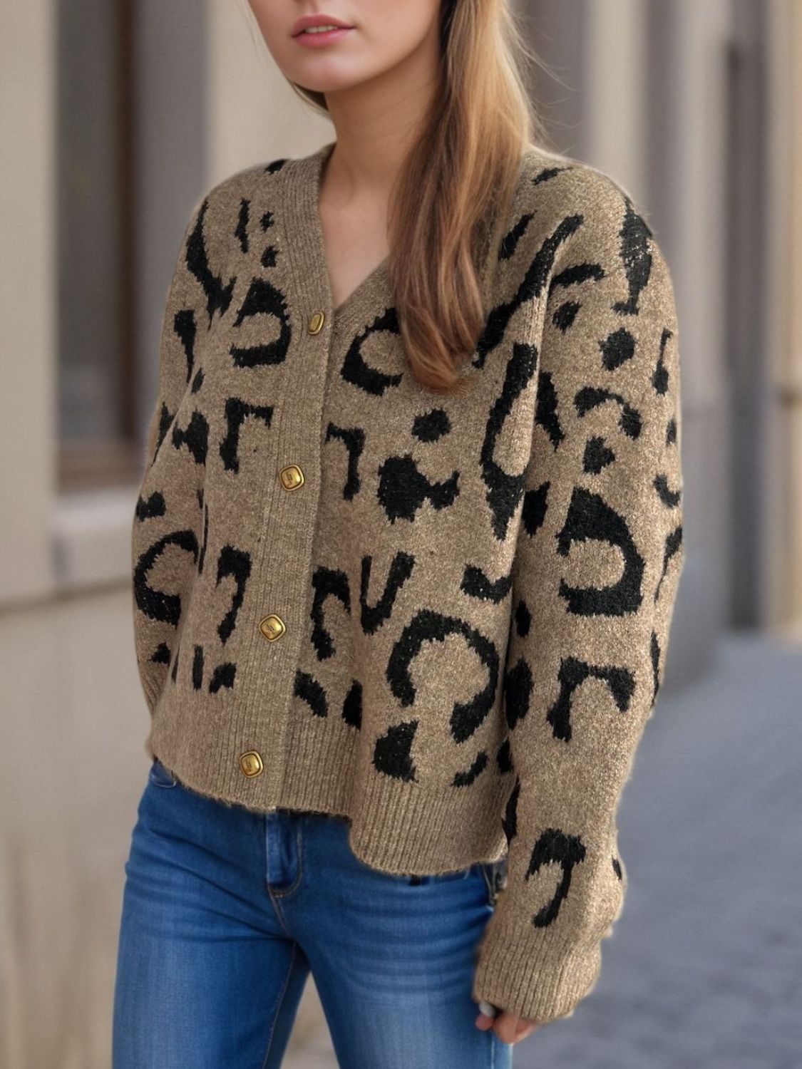 Leopard print V-neck button up cardigan.
