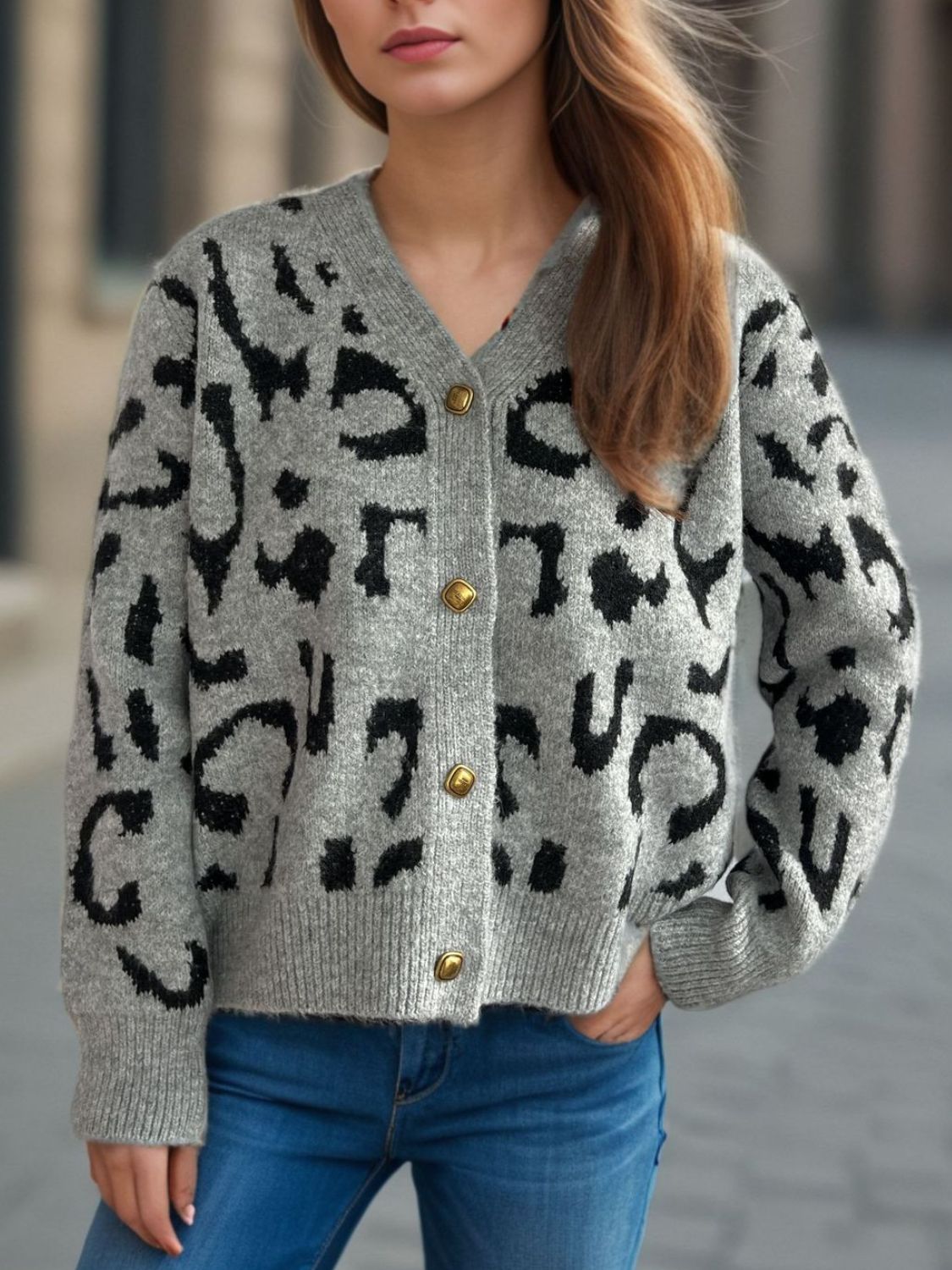 Leopard print V-neck button up cardigan.