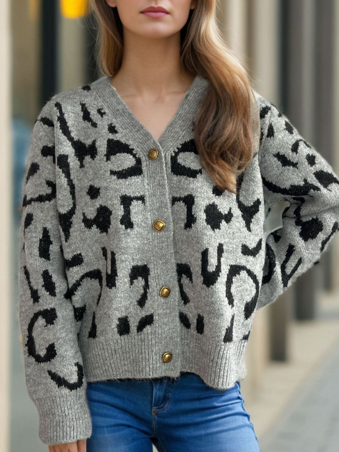 Leopard print V-neck button up cardigan.
