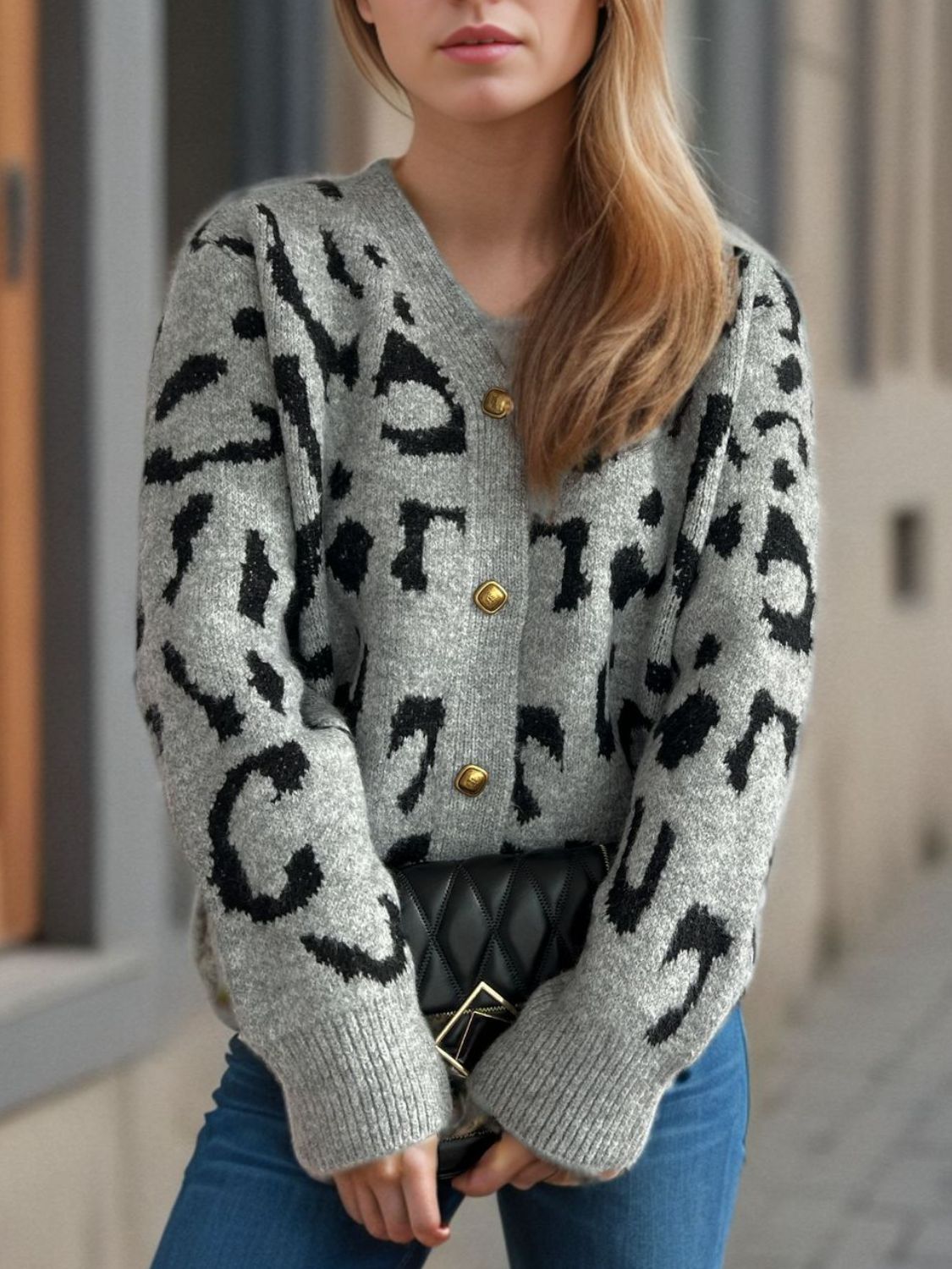 Leopard print V-neck button up cardigan.