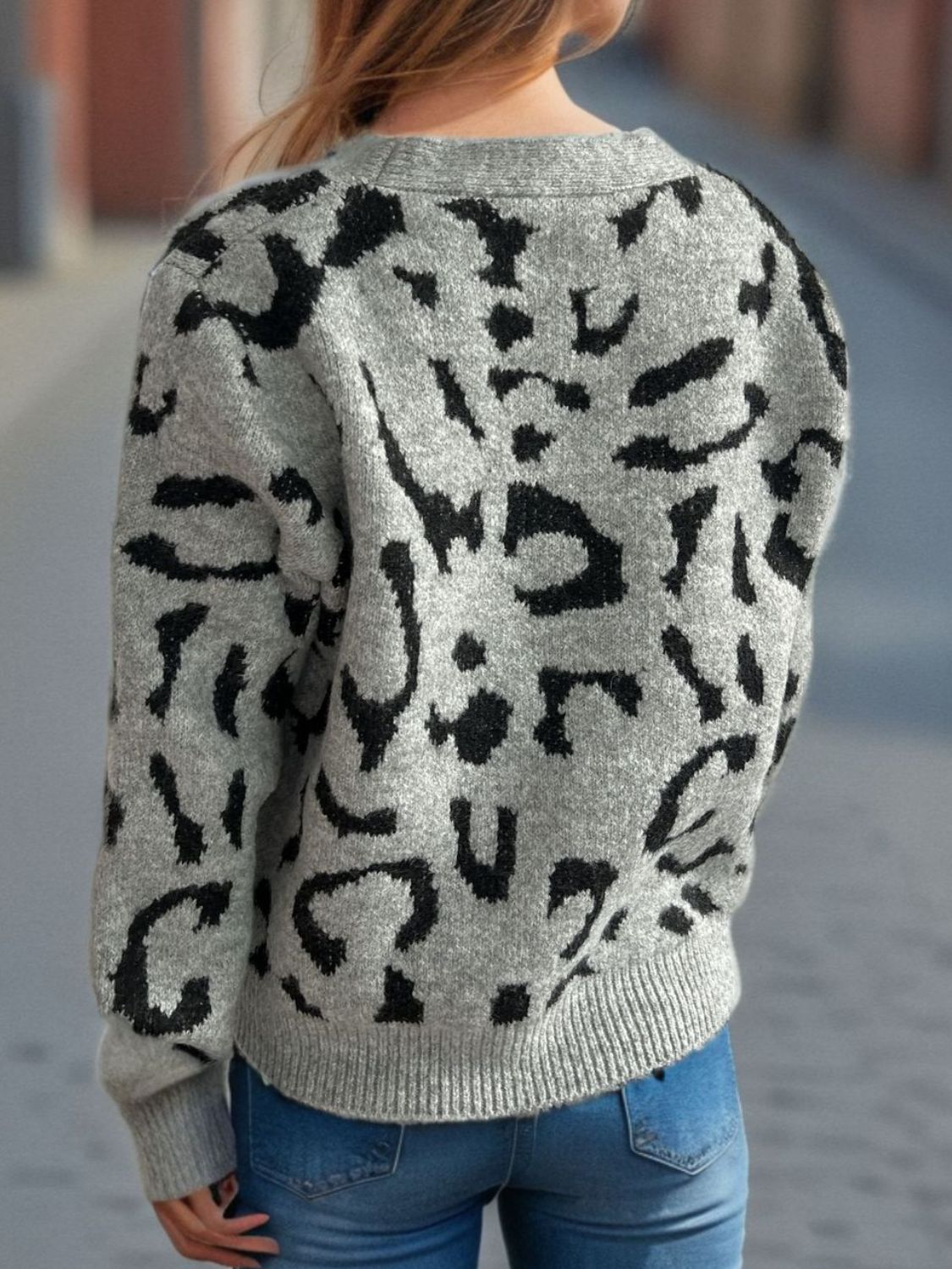 Leopard print V-neck button up cardigan.