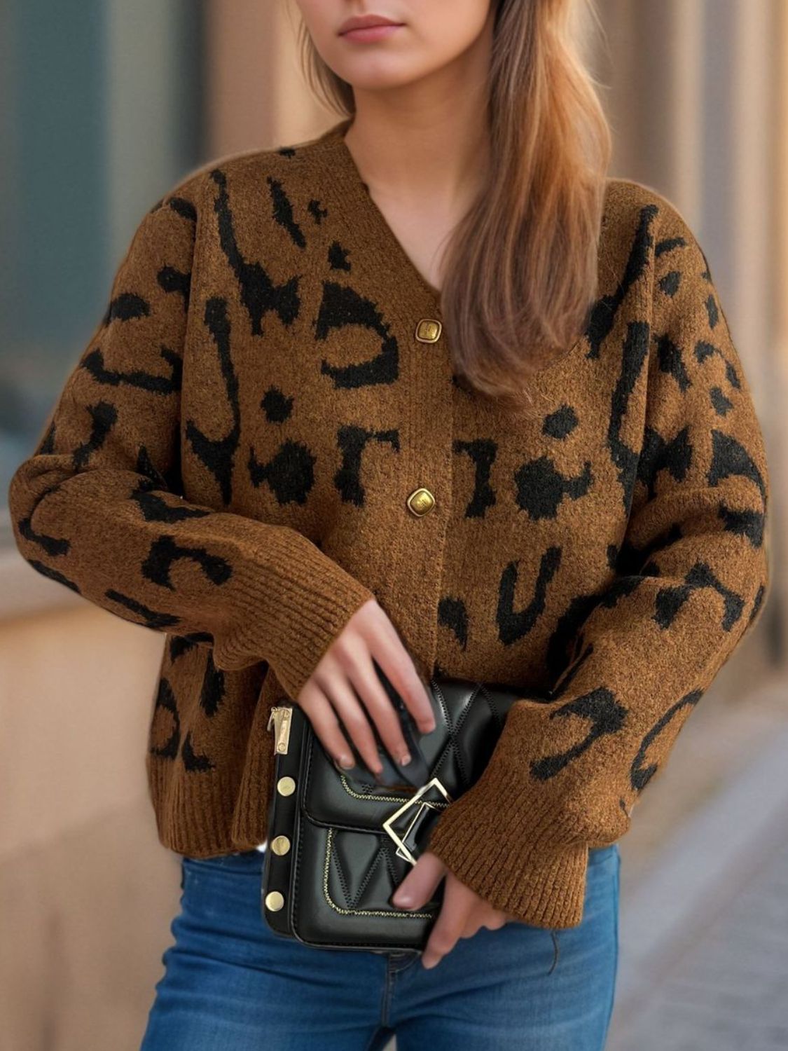 Leopard print V-neck button up cardigan.