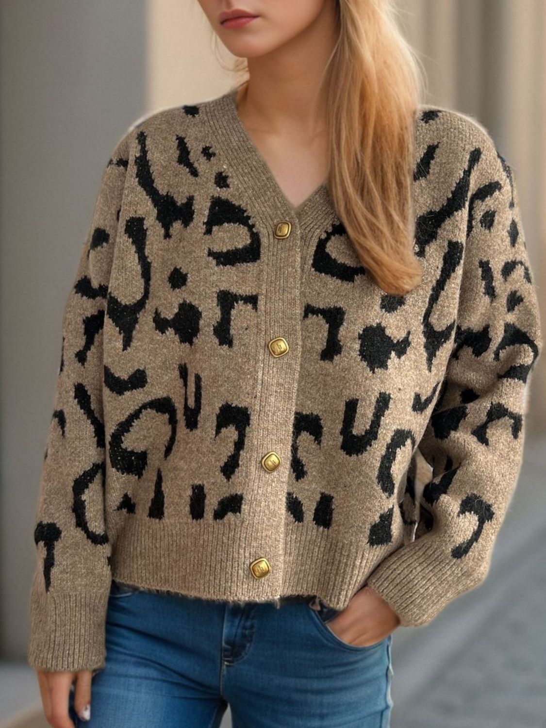 Leopard print V-neck button up cardigan.