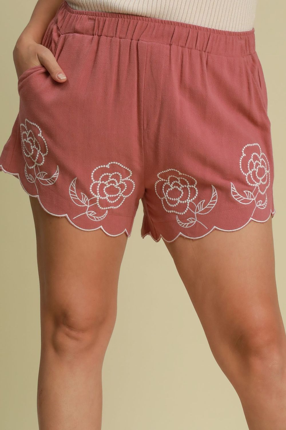 Low rise patched pocket shorts.
