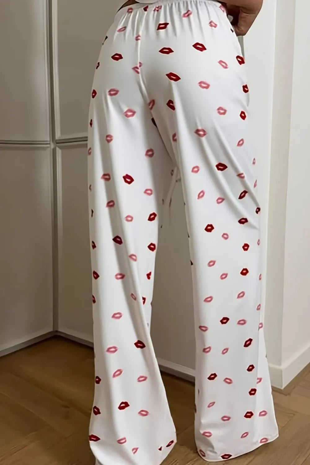 Lips print wide leg pants with drawstring and pockets.