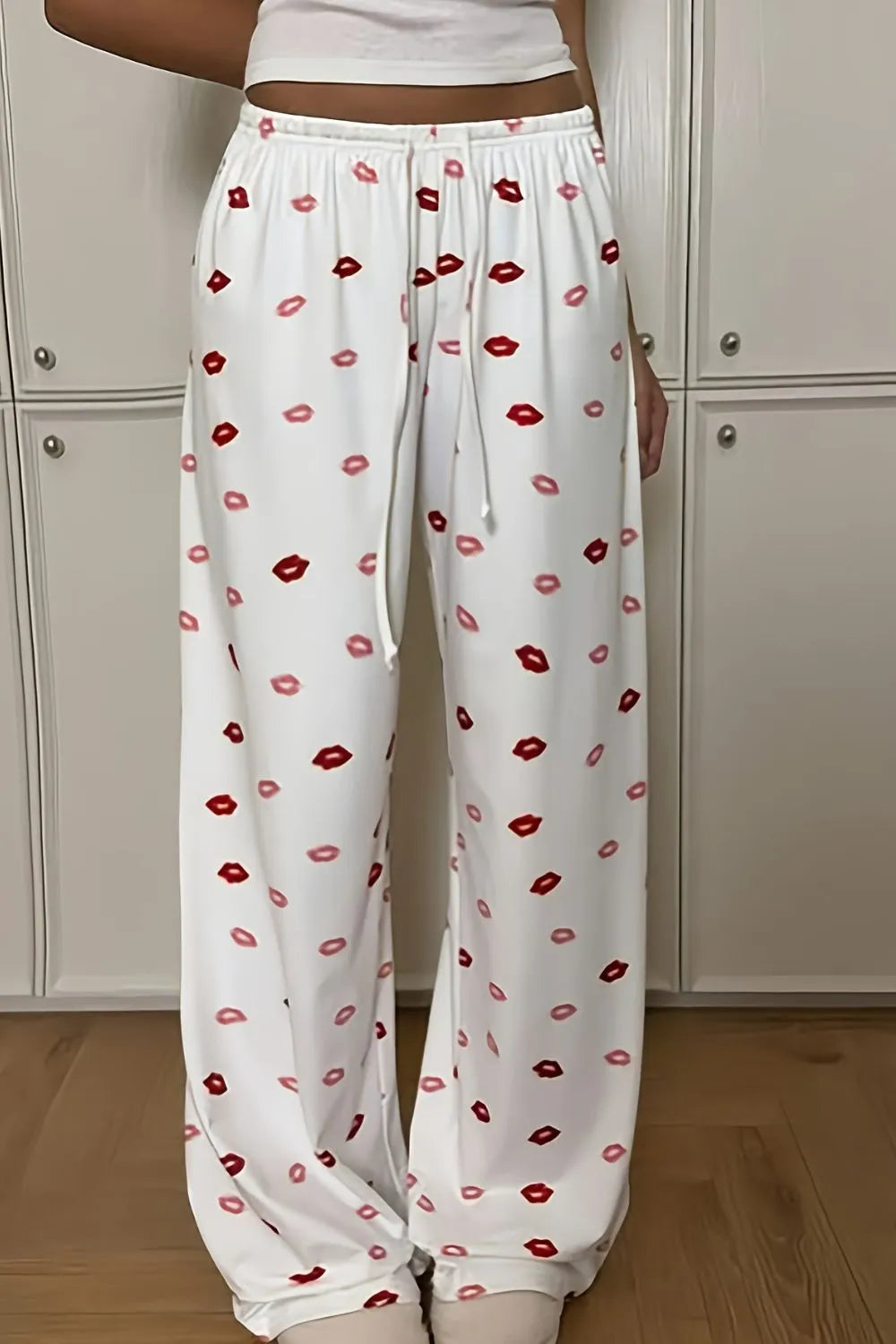 Lips print wide leg pants with drawstring and pockets.