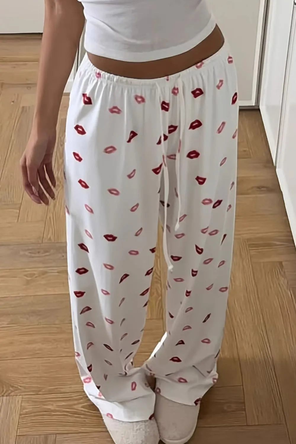 Lips print wide leg pants with drawstring and pockets.