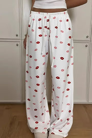 Lips print wide leg pants with drawstring and pockets.