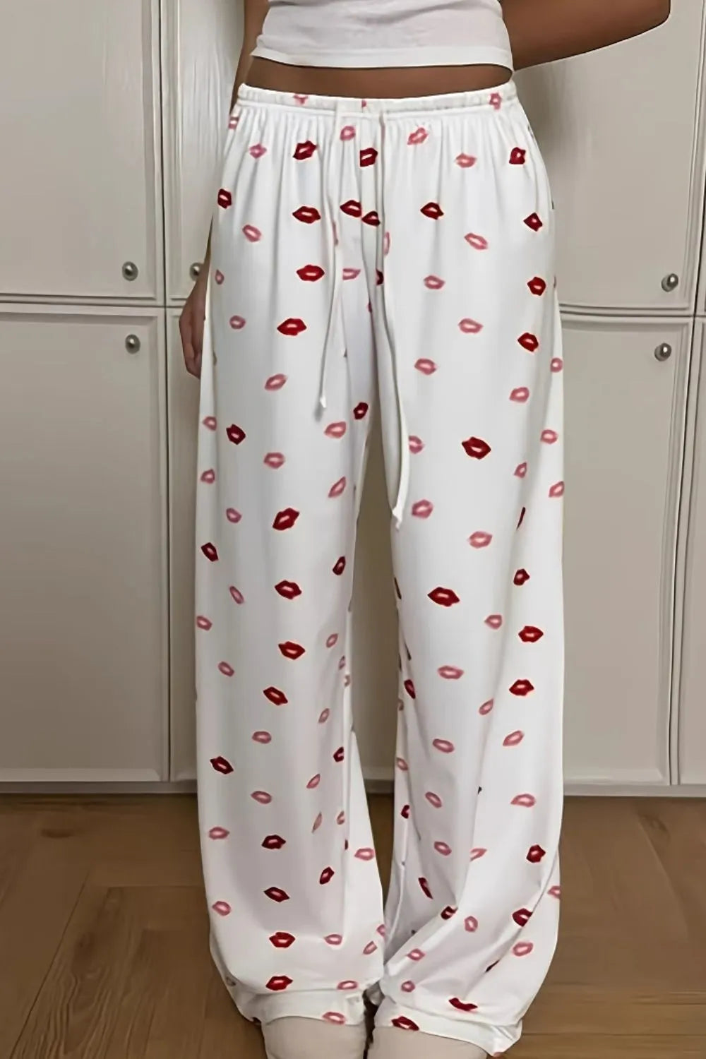 Lips print wide leg pants with drawstring and pockets.