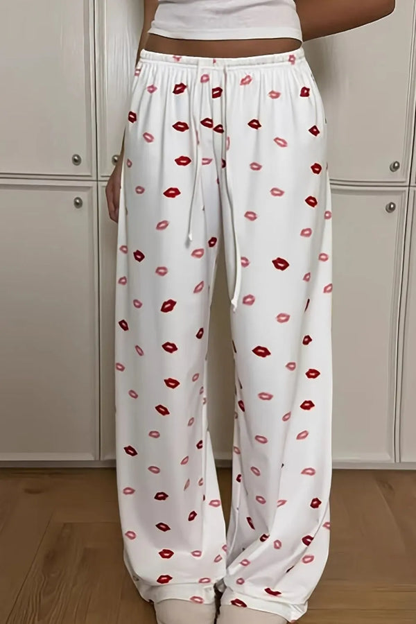 Lips print wide leg pants with drawstring and pockets.