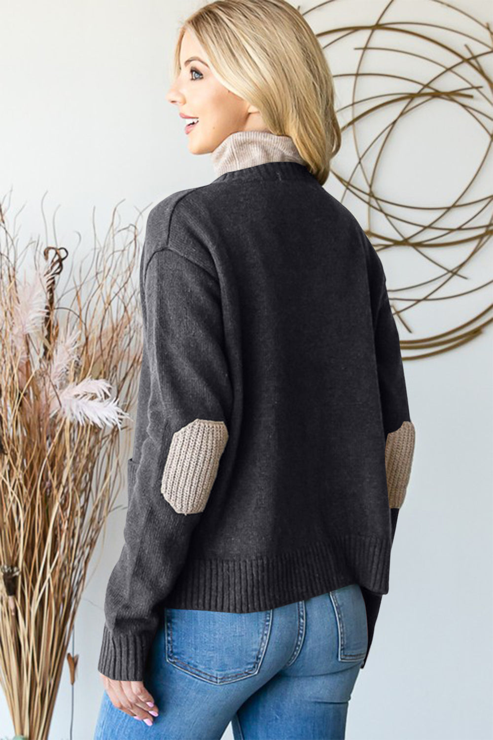 Full size long sleeve V-neck button down cardigan with pockets and ribbed details.