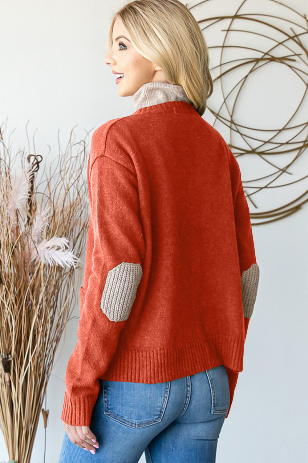 Full size long sleeve V-neck button down cardigan with ribbed details and pockets.